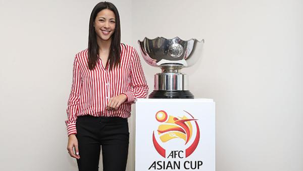 AFC Asian Cup media ambassador Tara Rushton poses with the trophy.