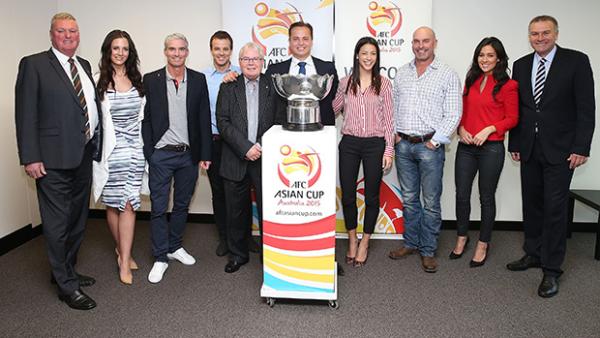 The AFC Asian Cup Australia 2015 Media Ambassadors alongside the trophy.