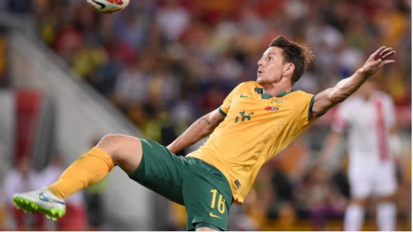 Socceroo Nathan Burns brings the ball under control against China.