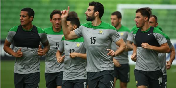 Captain Mile Jedinak leads the Socceroos in training.