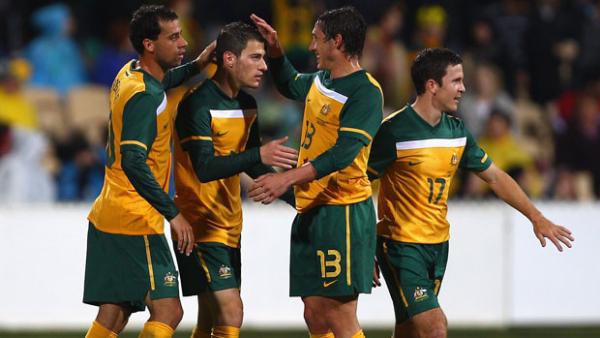 The players celebrate James Troisi's late penalty in the 3-0 win.