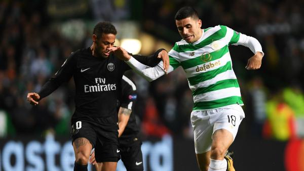 Caltex Socceroo Tom Rogic battles Neymar for possession during Celtic's heavy UCL loss to PSG.