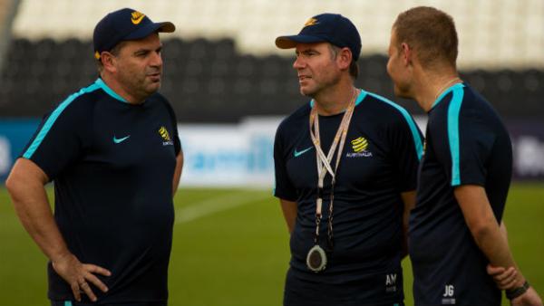 Caltex Socceroos coach Ange Postecoglou talks to assistants Ante Milicic and Josep Gombau.