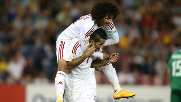 UAE's Ali Mabkhout celebrates a goal with teammate Omar Abdulrahman.
