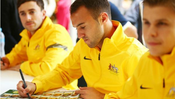 Socceroos Tommy Oar, Ivan Franjic and Mitch Langerak sign autographs for Socceroo fans.
