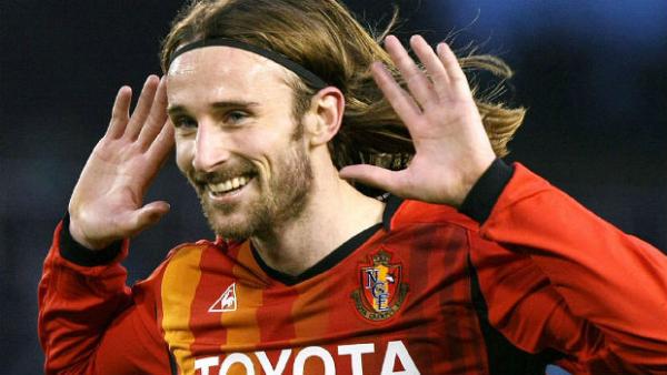 Former striker Josh Kennedy celebrates scoring for J-League club Nagoya Grampus.