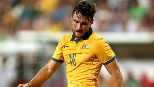 James Holland in action for the Socceroos.