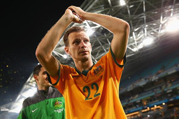Alex Wilkinson acknowledges the crowd following Australia's 1-1 draw against South Africa.