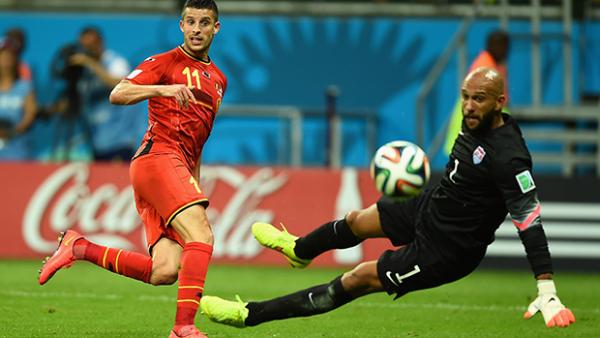 Howard saves a shot from Belgium striker Kevin Mirallas.