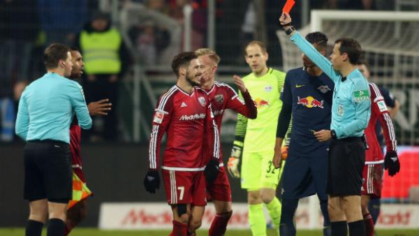 Mathew Leckie is shown a red card by the referee in FC Ingolstadt's win over RB Leipzig.