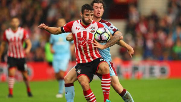 Sam McQueen of Southampton holds off Aiden O'Neill of Burnley.