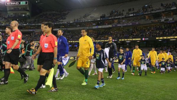 The Caltex Socceroos and Greece walk onto Etihad Stadium ahead of kick-off in their friendly earlier this month.