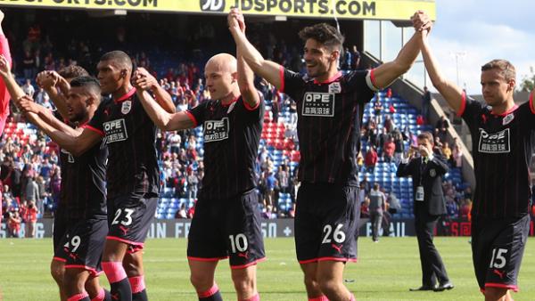Aaron Mooy starred in Huddersfield's 3-0 win over Crystal Palace.