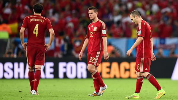 Spanish players look on after going down 2-0 to Chile.