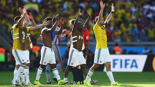 Colombia players herald their supporters after accounting for Greece in Group C.