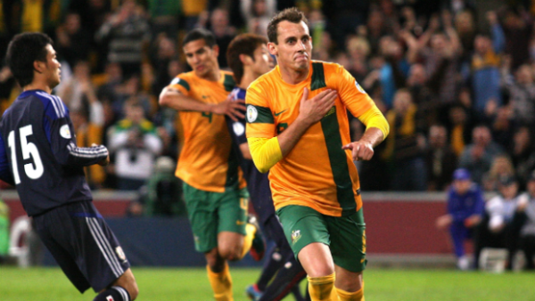Luke Wilkshire celebrates scoring for the Socceroos against Japan at Brisbane Stadium in 2012.