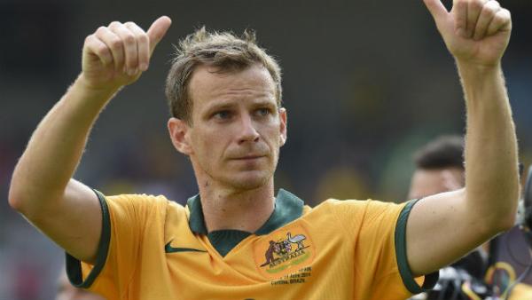 Socceroos defender Alex Wilkinson celebrates Australia's 2015 Asian Cup win.