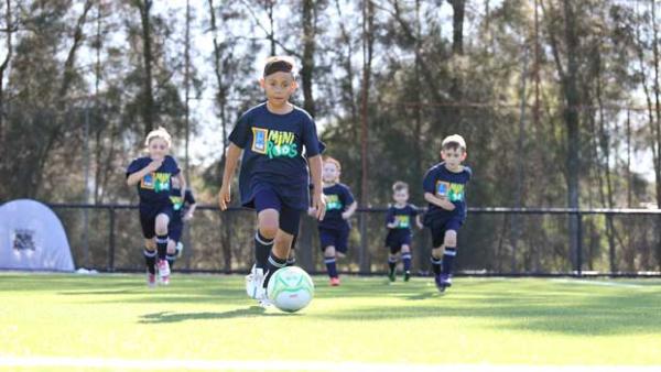 Young footballers enjoying the ALDI Miniroos activities.