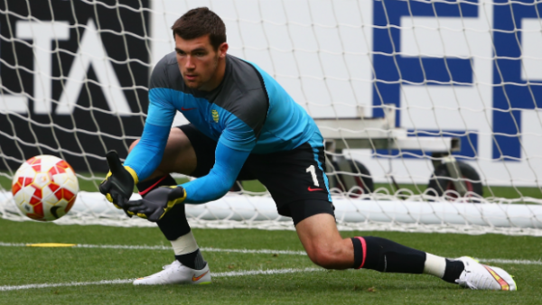Goalkeeper Mat Ryan makes a save in Socceroos Asian Cup training.