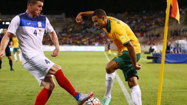 James Meredith challenges for the ball with Kyrgyzstan's Viktor Maier.