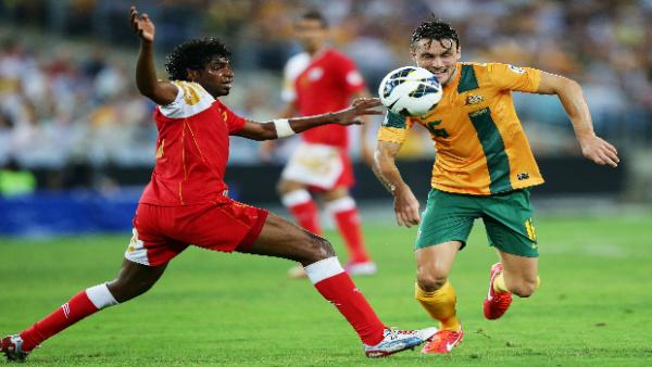 James Holland fights for the ball against Oman in March 2013.