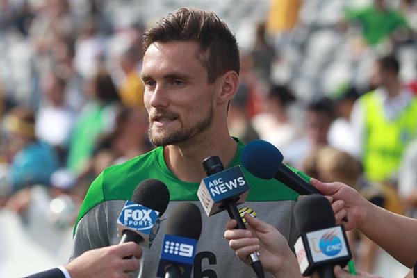Midfielder James Holland talks to media at the Socceroos Fan Day on Sunday.