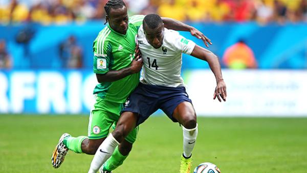 Matuidi holds off a challenge from Nigerian striker Victor Moses.