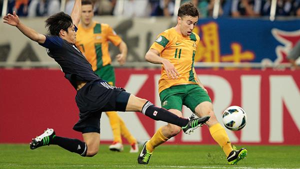 Tommy Oar evades a challenge in Australia's WCQ against Japan in June 2013.