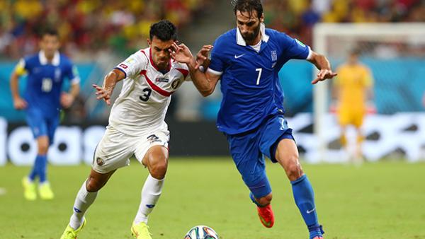 Gonzalez challenges Giorgos Samaras during Costa Rica's victory over Greece.