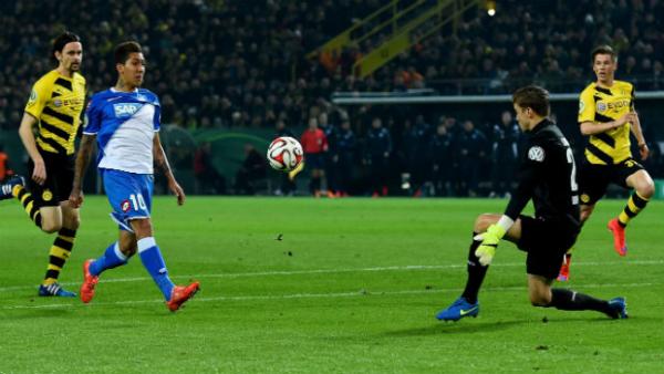 Dortmund's Mitch Langerak tries to make a save against Hoffenheim's Roberto Firmino.