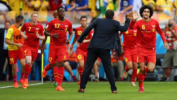 Belgium's Marouane Fellaini celebrates scoring his equlaiser with coach Marc Wilmots.
