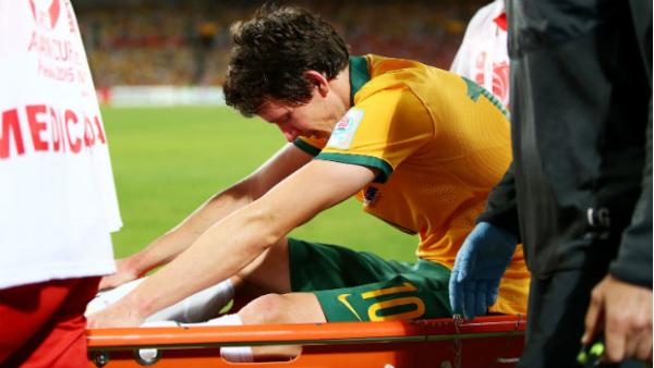Socceroo Robbie Kruse leaves the Asian Cup final on a stretcher.
