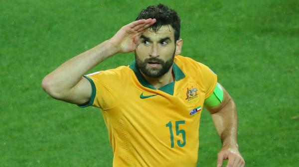 Socceroos captain Mile Jedinak salutes the crowd after scoring against Kuwait at the Asian Cup.
