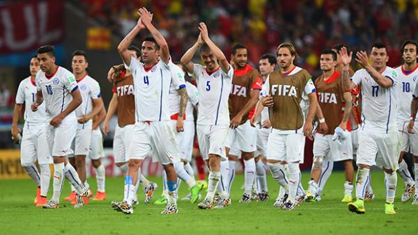 Chile celebrate their win over Spain and progression to the next round of the FIFA World Cup.
