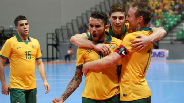 The Futsalroos celebrate scoring against Malaysia.