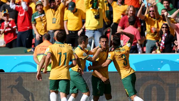 The Socceroos celebrate after Tim Cahill's stunning volleyed goal against the Dutch.