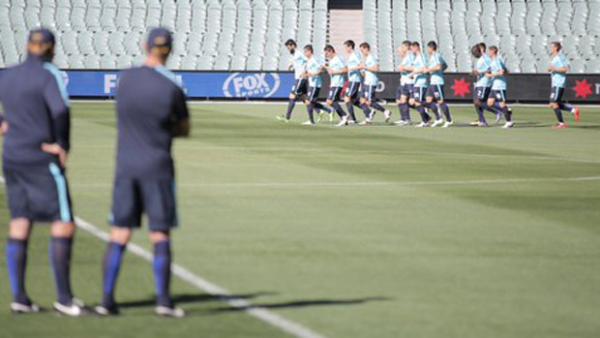 Socceroos players are put through their paces in their first training session in Adelaide.