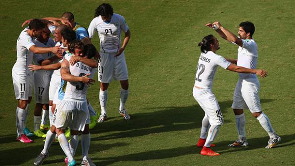 Uruguay celebrate after their 1-0 victory over Italy.