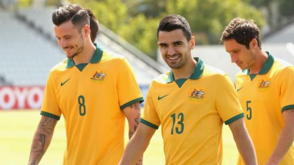 Socceroo defender Aziz Behich with James Holland and Mark Milligan.