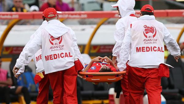 Lee Chung yung is taken from the field after suffering a leg injury against Oman.