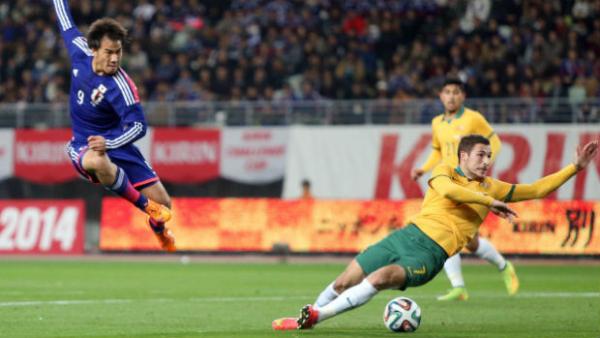 Japan's Shinji Okazaki unleashes a shot on goal during a friendly against the Socceroos in 2014.