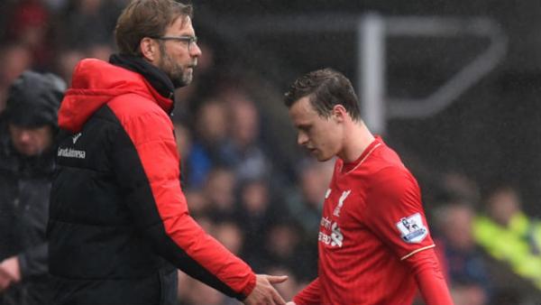 Liverpool manager Jurgen Klopp shakes hands with Brad Smith after he is subbed for the Reds last season.