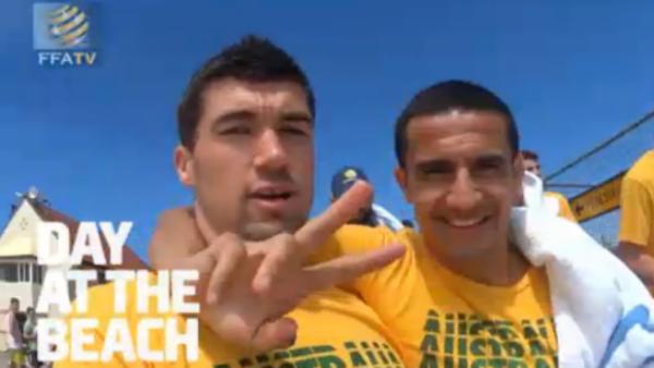 Mat Ryan and Tim Cahill and the Socceroos recovery session on Newcastle Beach.
