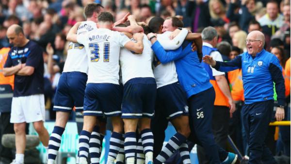 Preston North End players celebrate scoring against Chesterfield in the League One play-offs.