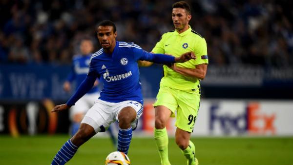 Asteras Tripolis FC striker Apostolos Giannou (right) vies for the ball with Schalke's Joel Matip in the Europa League.