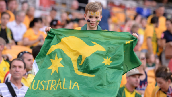 A young Socceroos fan gets behind Australia in Brisbane.