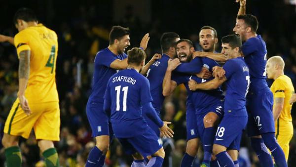 Greek players celebrate Ioannis Maniatis' long-range stunner against Australia.