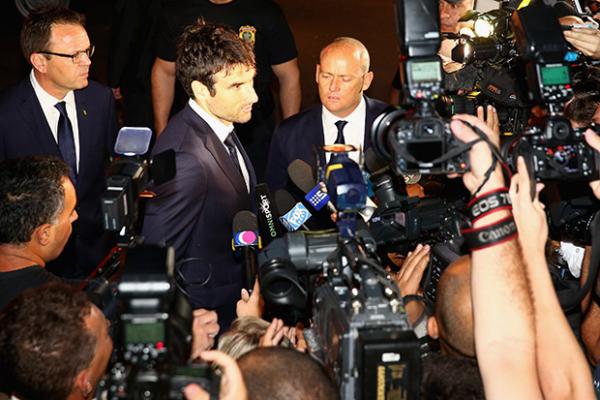 Socceroos captain Mile Jedinak addresses the media throng on Australia's arrival in Vitoria.