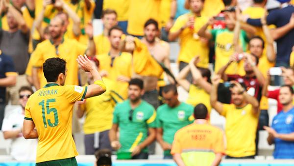 Mile Jedinak salutes Socceroos fans at the World Cup.