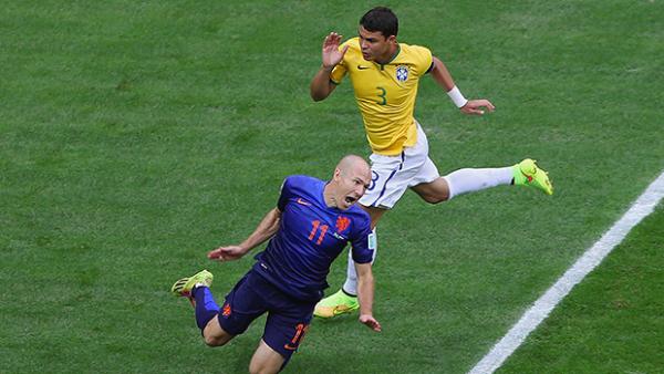 Silva brings down Arjen Robben during Brazil's 3-0 loss to the Netherlands.